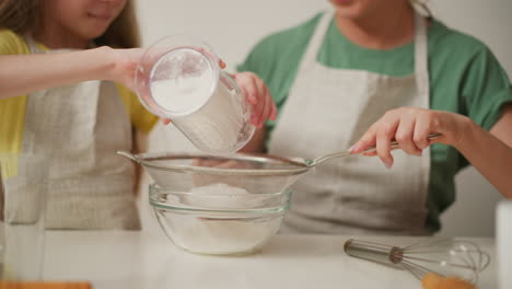 daughter and mother baking together