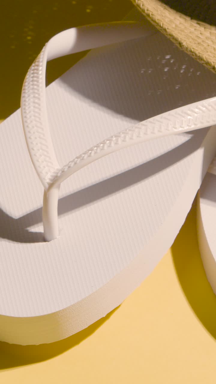Vertical Video Summer Holiday Vacation Concept Of Flip Flops Sandals Sun Hat On Yellow Background