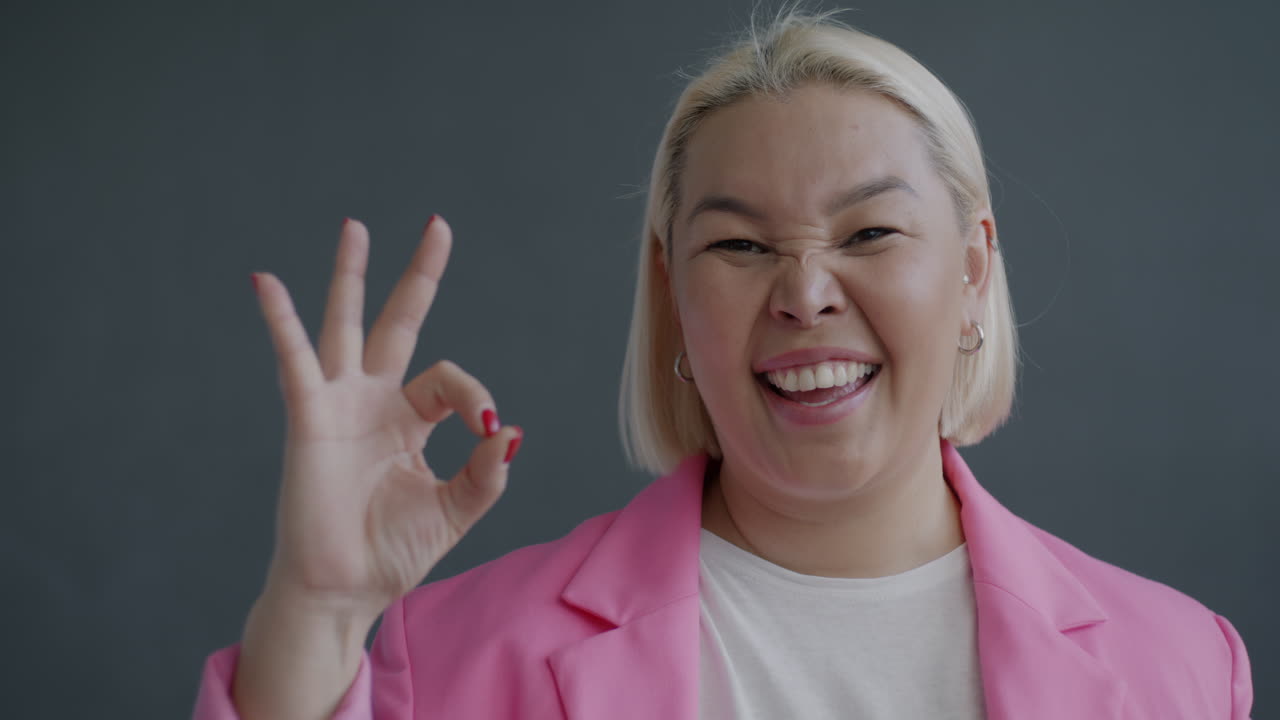 Smiling Woman in a Pink Blazer