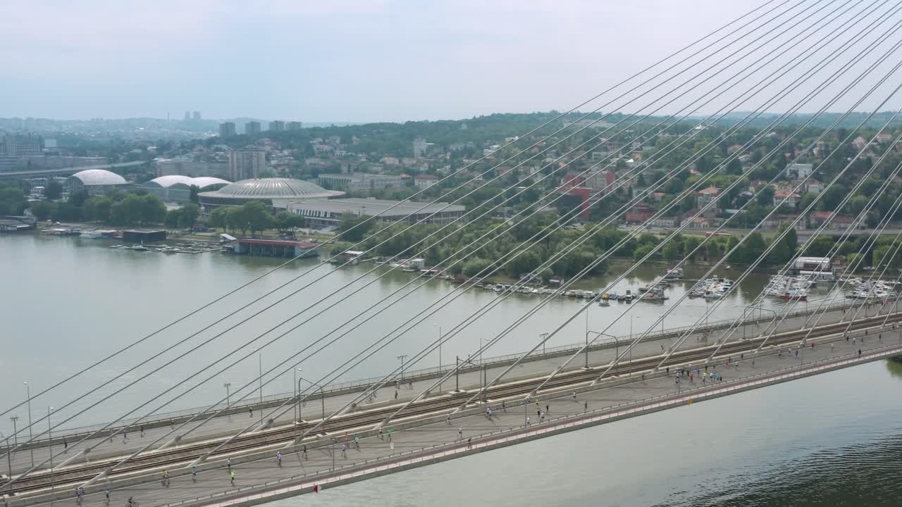 Aerial View of Runners Crossing Ada Bridge During Belgrade Marathon In Serbia