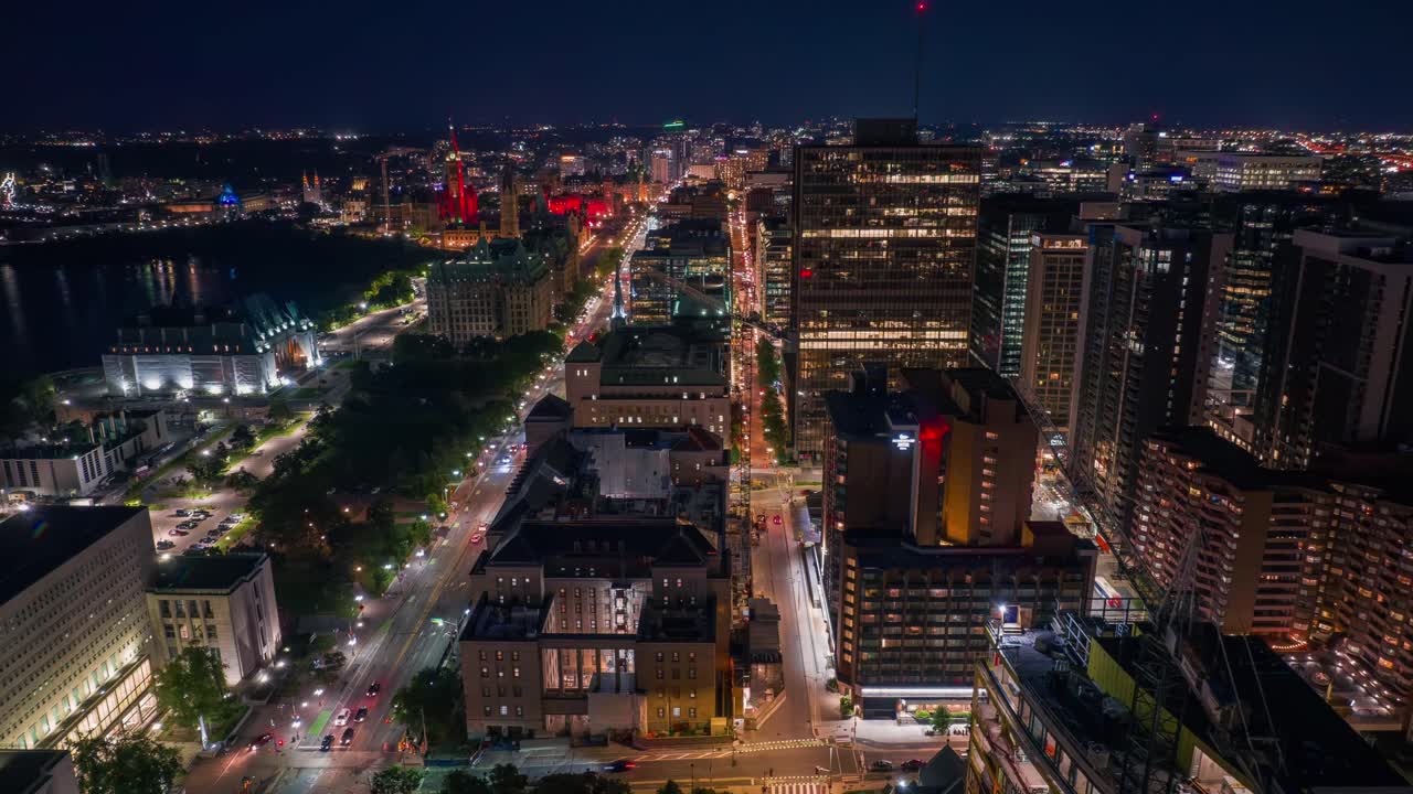Aerial dolly left aerial timelapse of downtown Ottawa, Canada's capital at night