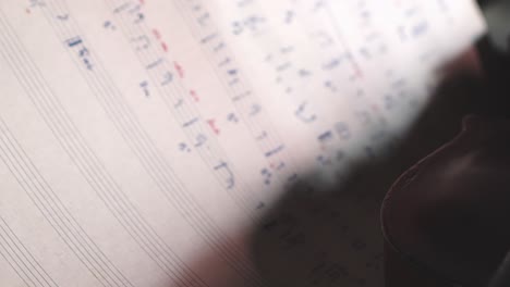 pull focus reveals composers music sheet with classical violin