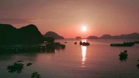 fiery sunset over the waters and mountains of catba island in vietnam -aerial