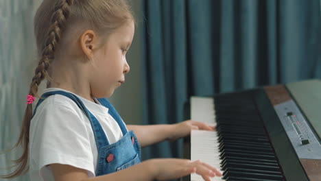 portrait-of-little-cute-girl-playing-on-dusty