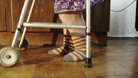 Elderly-woman-going-slowly-with-the-help-of-walker