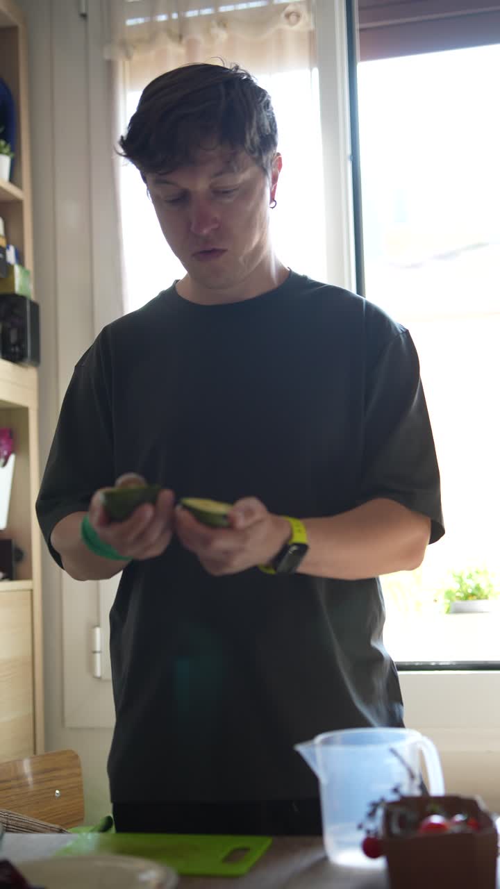 Person preparing avocado and lime