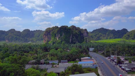 Tropical-landscape-karst-mountains-road-palm-trees