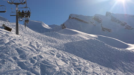 ski area in the swiss alps with people and chairlifts in the winter ski area of beckenried