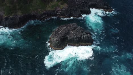 White-foam-like-waves-crashing-into-rock-formed-near-coastline