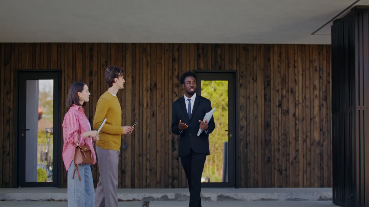 Real Estate Agent Showing Property to Couple