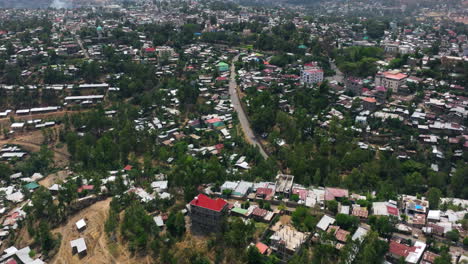 houses on the hilltop in gondar city, ethiopia. - aerial shot