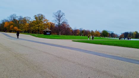 people walking in city park, london, uk