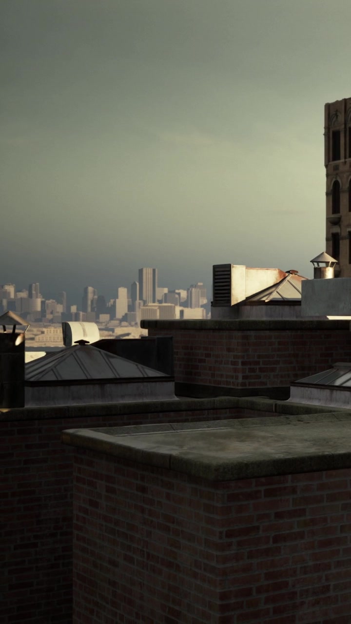 View of city buildings from a rooftop during cloudy weather in late afternoon