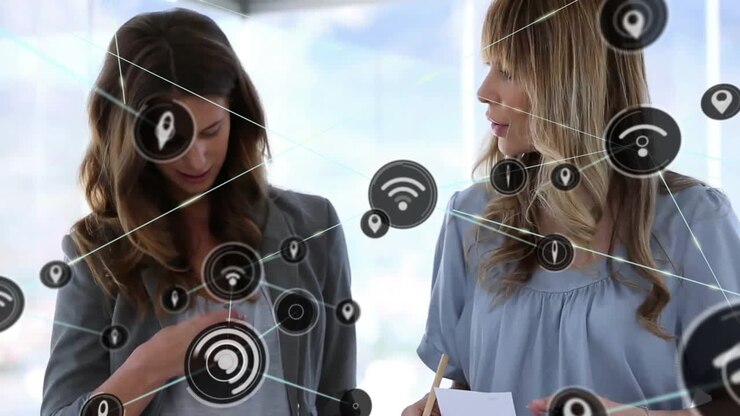 Animation of network of connections with wifi icons over caucasian businesswomen