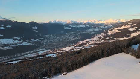 areal drone video over mountain village bressanone in italy while suset