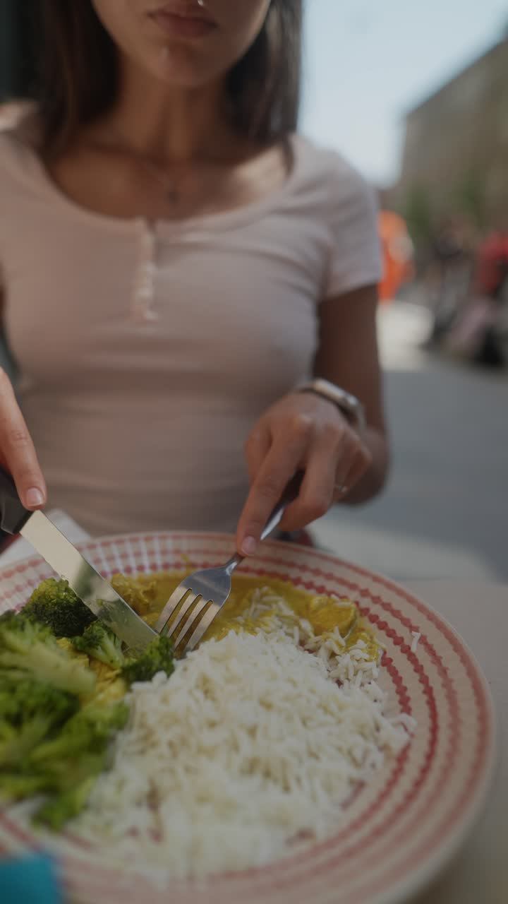 Woman Eating Curry with Rice and Vegetables