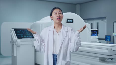 asian woman doctor showing puzzled gesture and saying what with mri machine in the hospital