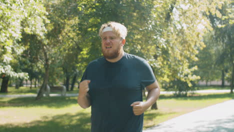 overweight man running in park