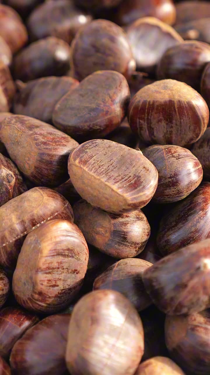 Close-up View of a Pile of Fresh Brown Chestnuts
