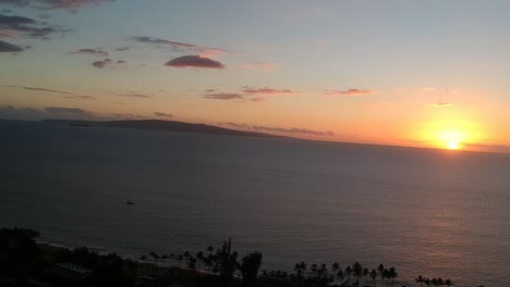 AERIAL-VIEW-DRONE-FOOTAGE-OF-THE-SURF-OFF-THE-COAST-OF-KIHEI-MAUI-HAWAII-DURING-SUNSET-IN-1080