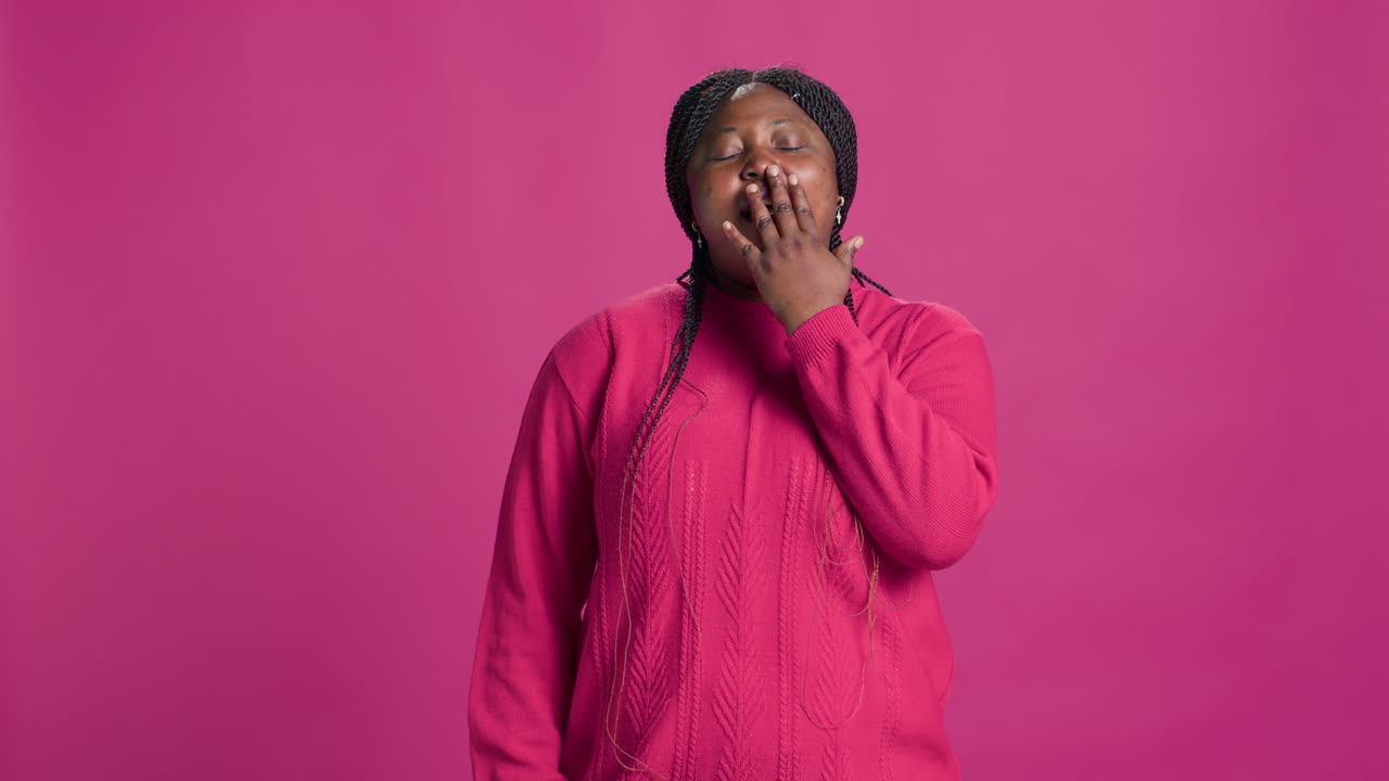 Female Yawning In Front Of Camera