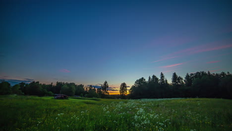 Colorful-moving-clouds-in-blue-sky-at-dawn-in-rural-landscape