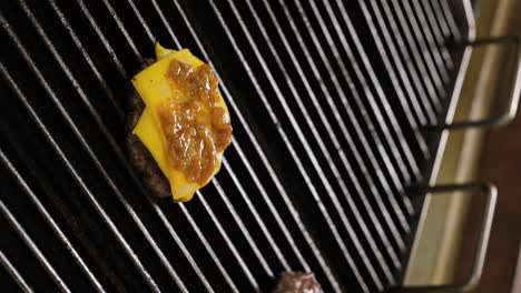 cheeseburger perfection: melting cheese on a juicy patty cooking