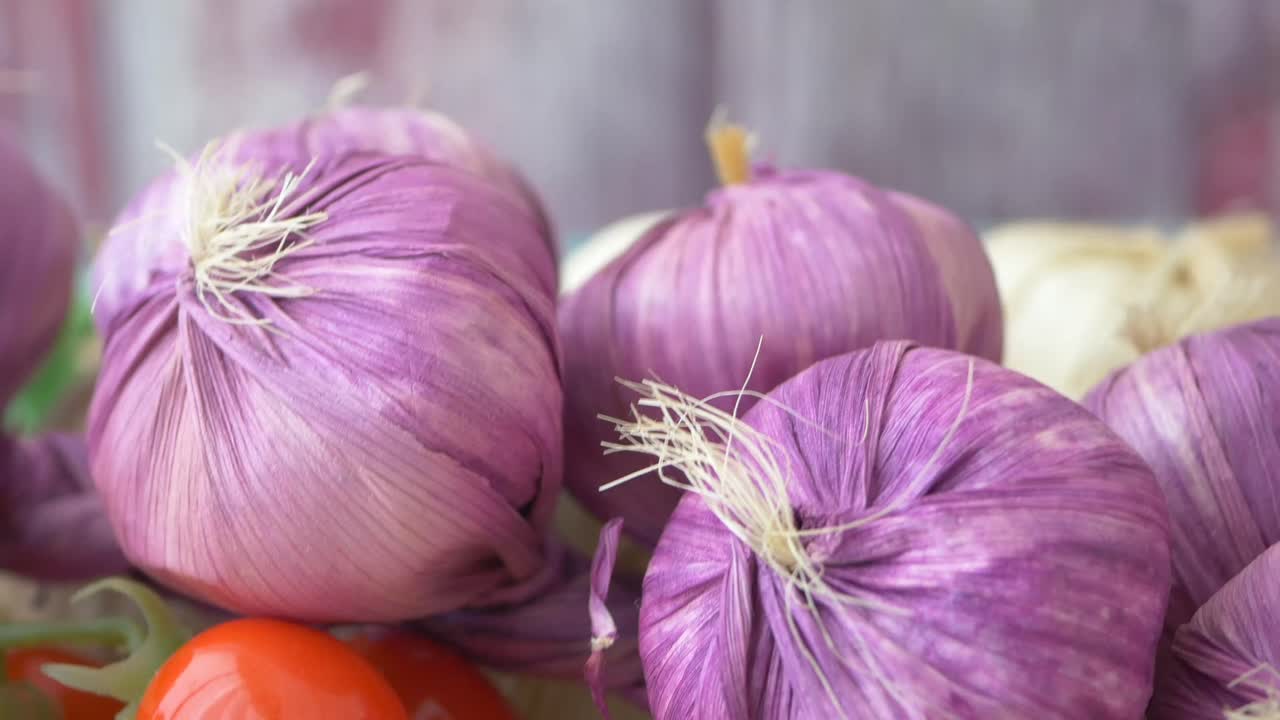 Purple Garlic Bulbs and Red Tomatoes