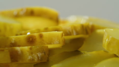 close-up of sliced dill pickles