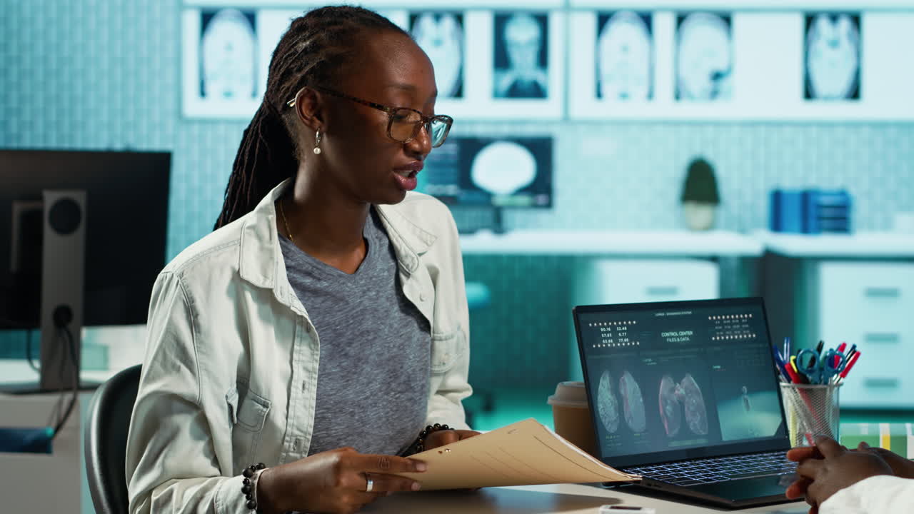 African american medic and patient having conversation about medical records