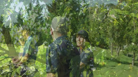 animation of trees over senior caucasian couple playing golf on golf course