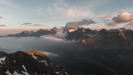 hyperlapse of a mountain range in the italian alps at sunset with moving clouds