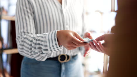 People,-hands-and-counting-money-at-checkout