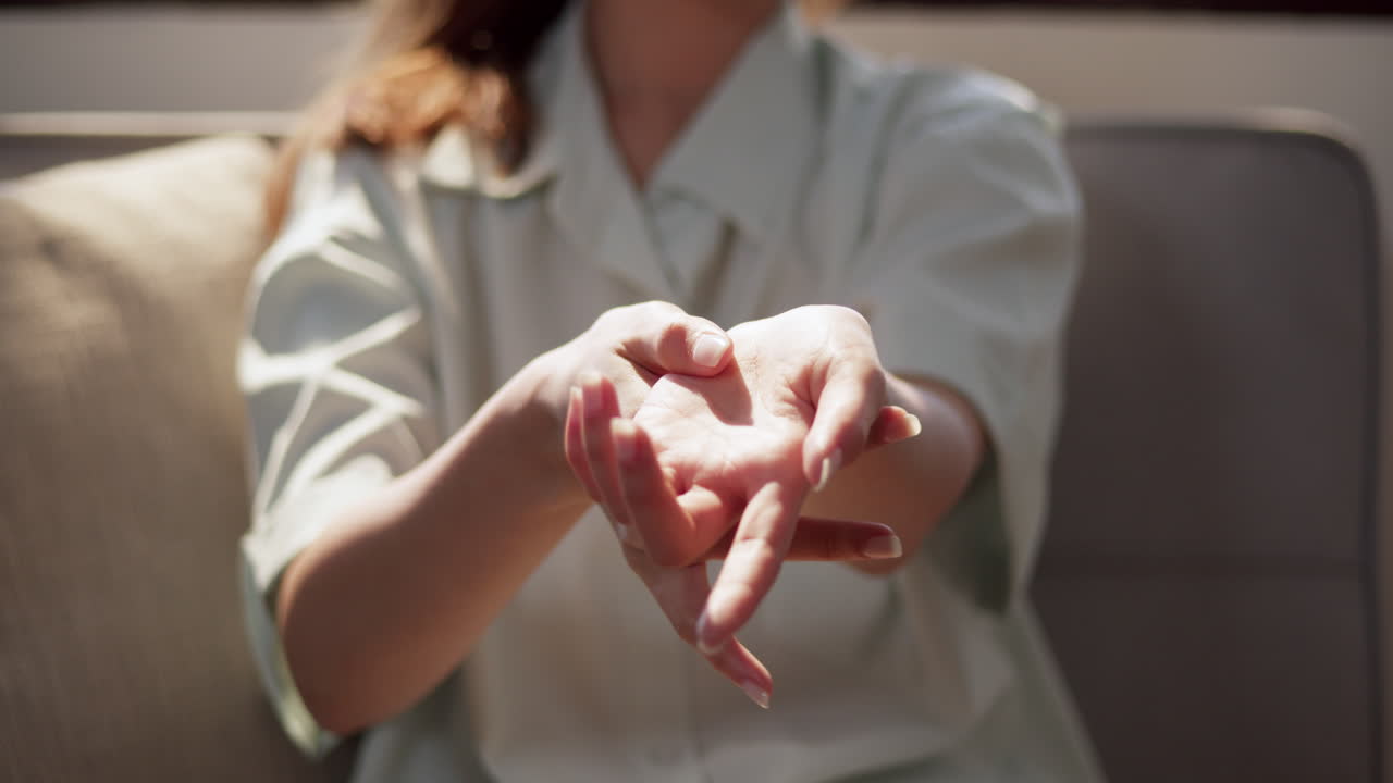 A captivating moment showcasing expressive hand gestures in a cozy home environment.