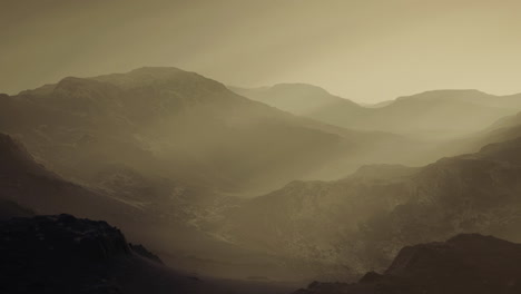 majestic mountain landscape shrouded in mist at dawn in a quiet valley
