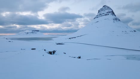 frozen kirkjufellsfossar, dramatic blue hour, iceland