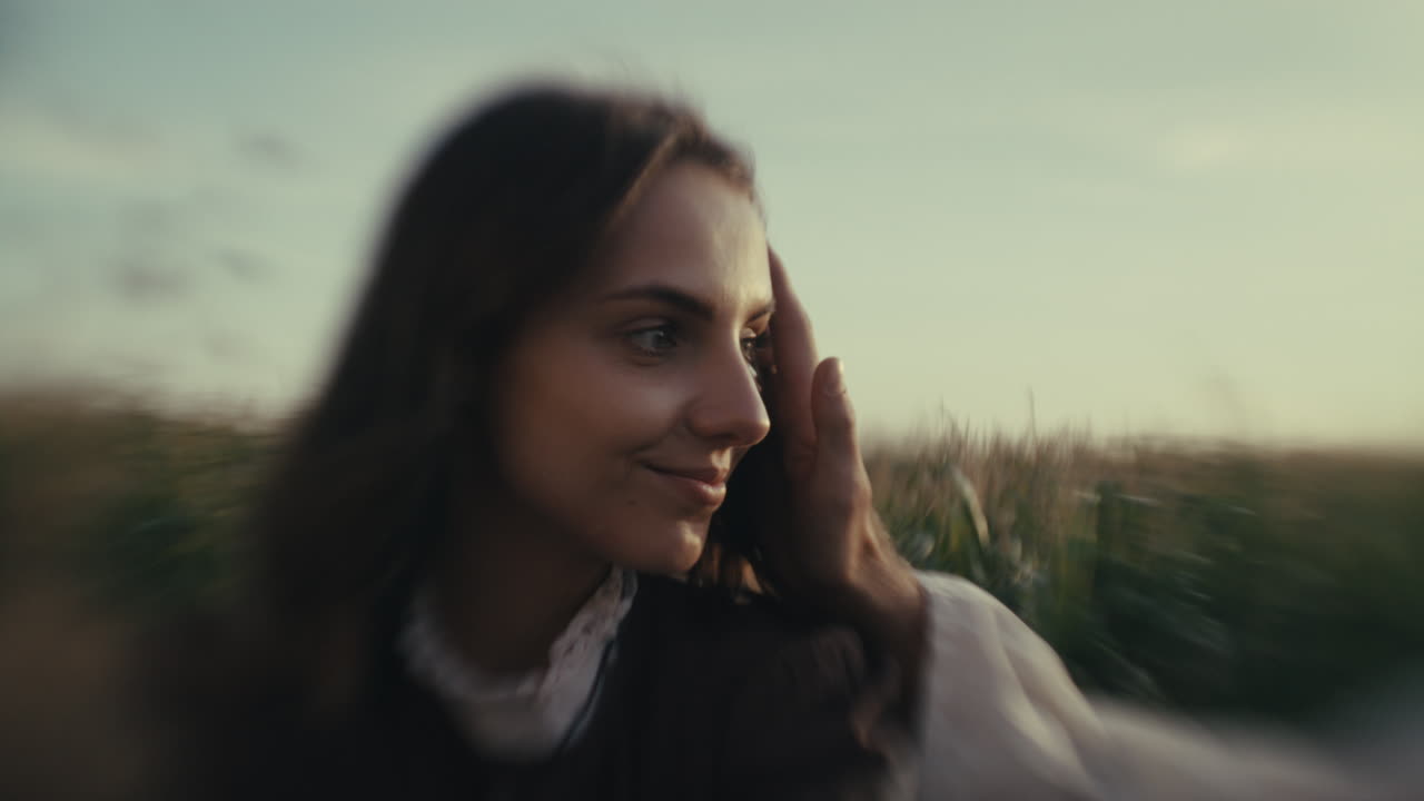 Close-up Portrait of a Woman in Traditional Attire in a Field
