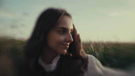 close-up portrait of a woman in traditional attire in a field