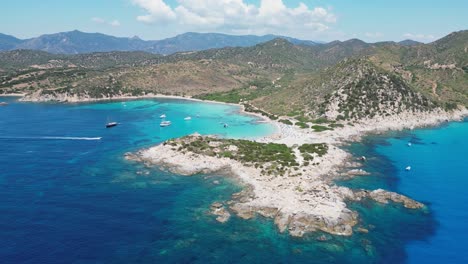 punta molentis beach in villasimius, sardinia - peninsula, white sandy beach and turquoise blue bay - aerial 4k circling