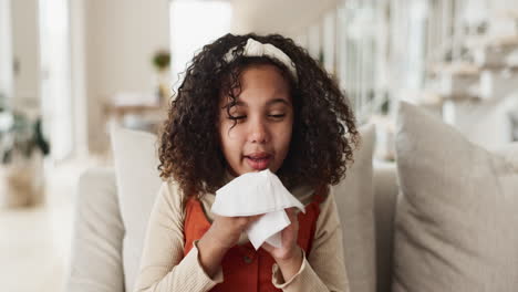 girl blowing nose with tissue