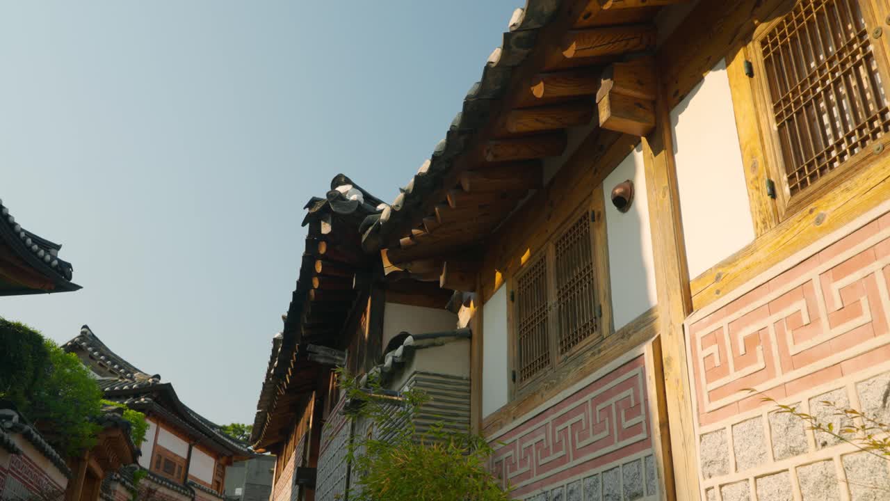 Bukchon Hanok Village Traditional Rooftops, Jongno-gu, Seoul, Korean Architecture at sunset pan shot
