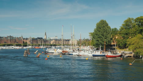 quay in sokholm beautiful yachts are moored boats with tourists are swimming beautiful european city