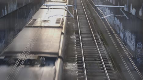 Subway-train-of-Milan-city-riding-in-early-morning,-handheld-view