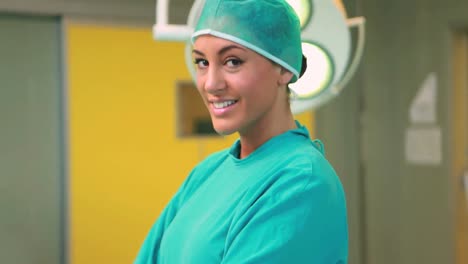 Nurse-smiling-while-wearing-a-surgical-equipment