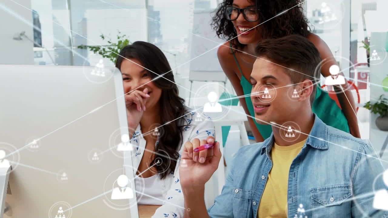 Animation of network of profile icons over diverse colleagues discussing over a computer at office