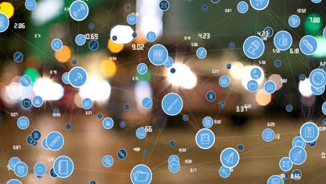 animation of connected media and social network icons and processing data over city street at night