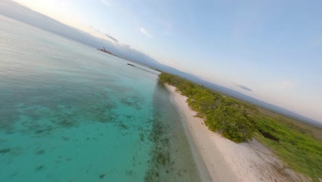 Stretch-Of-Sandy-Tropical-Beach-At-Cabo-Rojo-With-Wooden-Jetty-In-Puerto-Rico