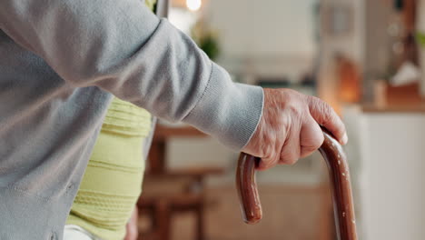 close up of an elderly woman holding a walking stick