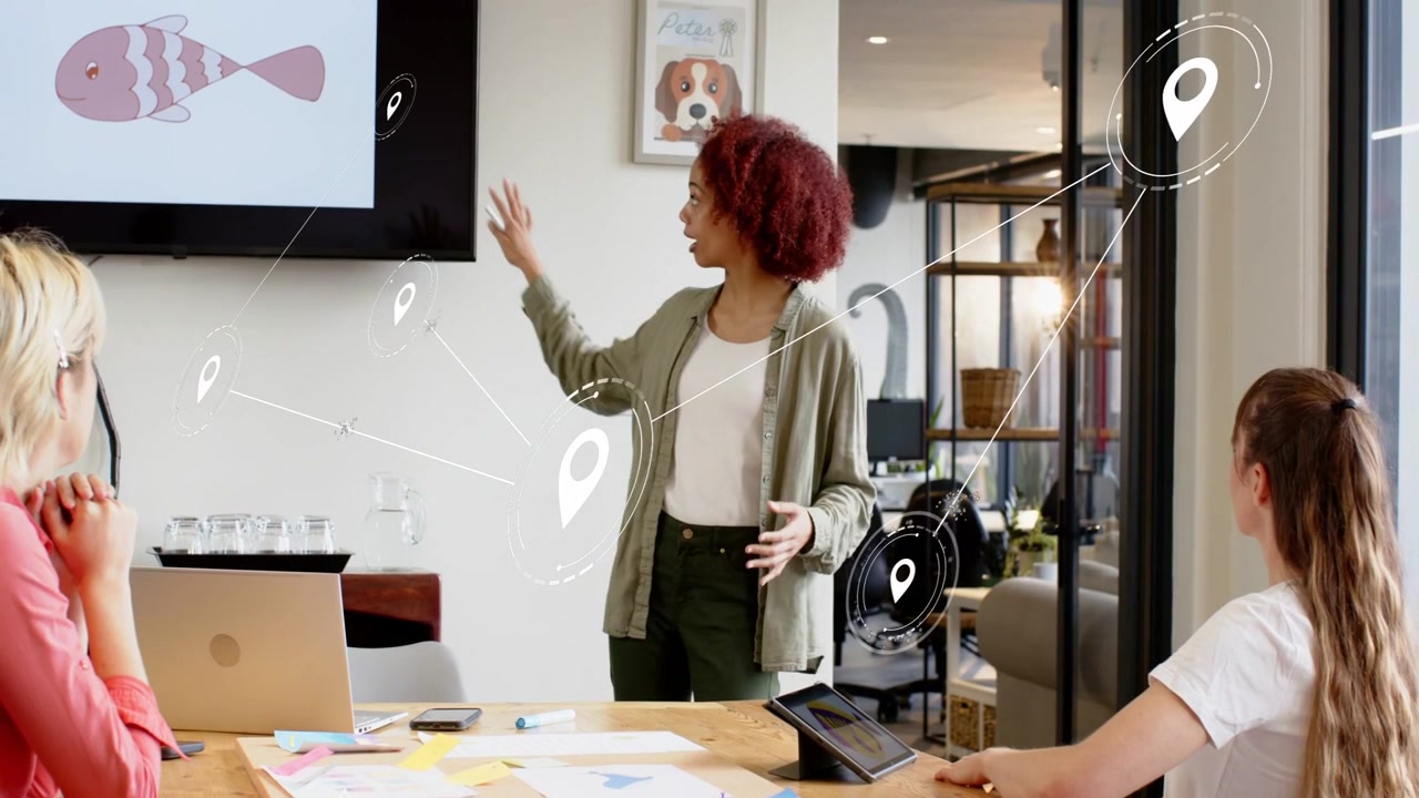 Creative meeting presenter pointing to display and guiding team, causing pins marking fish diagram