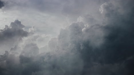 pov lightning flashes among thick clouds in the sky, thunderstorm